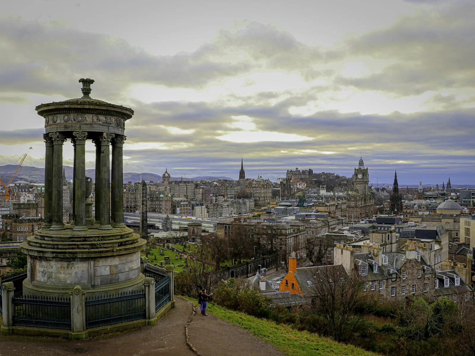 The Dugald Stewart Monument on Calton Hill overlooking the Edinburgh skyline